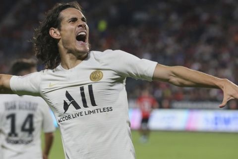 PSG's Edinson Cavani celebrates scoring the opening goal during the French League One soccer match between Rennes and Paris Saint Germain, in Rennes, Sunday, Aug. 18, 2019. (AP Photo/David Vincent)