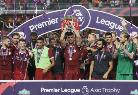 Liverpool FC players celebrates after winning the final match against Leicester City FC at the Premier League Asia Trophy soccer tournament in Hong Kong, Saturday, July 22, 2017. (AP Photo/Kin Cheung)