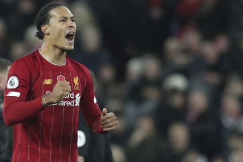 Liverpool's Virgil van Dijk celebrates at the end of the English Premier League soccer match between Liverpool and Manchester City at Anfield stadium in Liverpool, England, Sunday, Nov. 10, 2019. Liverpool won 3-1. (AP Photo/Jon Super)