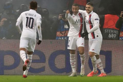 PSG's Kylian Mbappe, center, celebrates after scoring his side's fourth goal, with his teammates Neymar, left, and Mauro Icardi, during the Champions League, group A soccer match between PSG and Galatasaray, at the Parc des Princes stadium in Paris, Wednesday, Dec. 11, 2019. (AP Photo/Michel Euler)