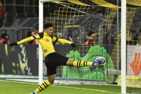 Dortmund's Jadon Sancho misses to score during the German Bundesliga soccer match between Borussia Dortmund and Werder Bremen in Dortmund, Germany, Saturday, Dec. 15, 2018. (AP Photo/Martin Meissner)