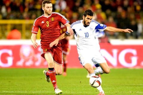 Belgium's Jan Verthongen, left, fights for the ball with Cyprus' Nestor Mytidis during the Euro 2016 Group B qualifying soccer match between Belgium and Cyprus, at the King Baudouin stadium, in Brussels on Saturday, March 28, 2015. (AP Photo/Laurent Dubrule)