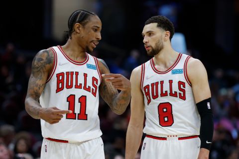 Chicago Bulls' DeMar DeRozan (11) and Zach LaVine (8) talk during the second half of an NBA basketball game against the Cleveland Cavaliers, Saturday, March 26, 2022, in Cleveland. (AP Photo/Ron Schwane)
