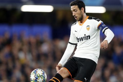 Valencia's Dani Parejo kicks the ball during the Champions League Group H soccer match between Chelsea and Valencia at Stamford Bridge stadium in London, Tuesday, Sept. 17, 2019. (AP Photo/Frank Augstein)