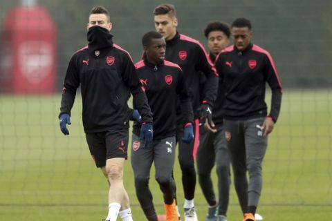 Arsenal's Laurent Koscielny attends a training session with teammates at London Colney, Wednesday Feb. 21, 2018. (Adam Davy/PA via AP)