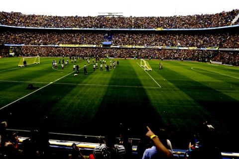 Thousands of Argentina's Boca Juniors fans watch a training session of their team, from the stands of the Bombonera stadium, in Buenos Aires, Argentina Thursday, Nov. 22, 2018. Boca Juniors faces River Plate for the Copa Libertadores soccer final game on Saturday. (AP Photo/Natacha Pisarenko)