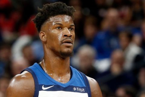 Minnesota Timberwolves' Jimmy Butler plays against the Houston Rockets in the first half during Game 3 of an NBA basketball first round playoff series Saturday, April 21, 2018, in Minneapolis. (AP Photo/Jim Mone)