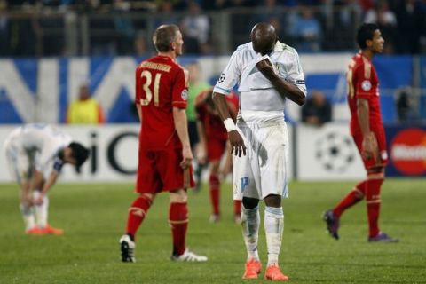 Olympique Marseille's Stephane Mbia (2nd R) reacts after their quarter-final first leg Champions League soccer match against Bayern Munich at the Velodrome Stadium in Marseille, March 28, 2012. REUTERS/Philippe Laurenson (FRANCE- Tags: SPORT SOCCER)