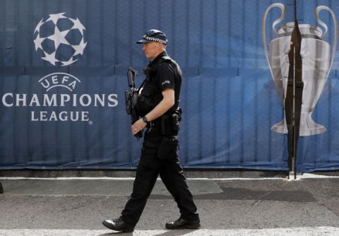An armed police officer guards outside the Millennium Stadium in Cardiff, Wales, ahead of the Champions League final soccer match between Juventus and Real Madrid on Saturday June 3, 2017. (AP Photo/Kirsty Wigglesworth)