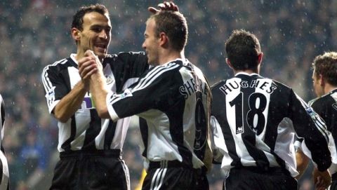 Newcastle's Alan Shearer (C) celebrates his goal with team mate Nikos Dabizas (L) after scoring against Spurs during their FA Barclaycard Premiership soccer match at Newcastle's St James' Park ground in Newcastle, Sunday 29 December 2002