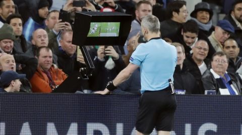 Referee Bjorn Kuipers checks the monitor during the Champions League, round of 8, first-leg soccer match between Tottenham Hotspur and Manchester City at the Tottenham Hotspur stadium in London, Tuesday, April 9, 2019. (AP Photo/Frank Augstein)