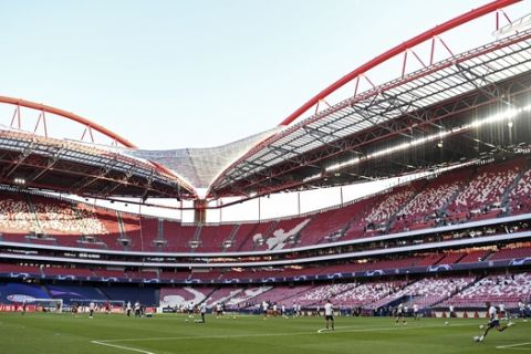 Players warm up prior the Champions League final soccer match between Paris Saint-Germain and Bayern Munich at the empty Luz stadium in Lisbon, Portugal, Sunday, Aug. 23, 2020. (David Ramos/Pool via AP)