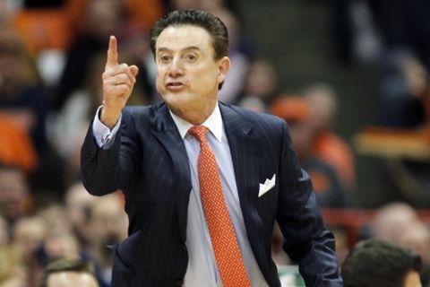 In this  Monday, Feb. 13, 2017 file photo, Louisville head coach Rick Pitino yells to his players in the second half of an NCAA college basketball game against Syracuse in Syracuse, N.Y. Rick Pitino has sued the school's University of Athletic Association for $38.7 million, Thursday, Nov. 30, 2017. The former Cardinals coach says the ULAA breached his contract by placing him on unpaid administrative leave without notice and firing him last month with no legally justified cause. Pitino's lawsuit filed Thursday in U.S. District Court seeks liquidated contract damages of $4.307 million through 2026. (AP Photo/Nick Lisi, File)