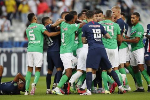Players scrum after PSG's Kylian Mbappe, left down, was tackled during the French Cup soccer final match between Paris Saint Germain and Saint Etienne at Stade de France stadium, in Saint Denis, north of Paris, Friday July 24, 2020. (AP Photo/Francois Mori)
