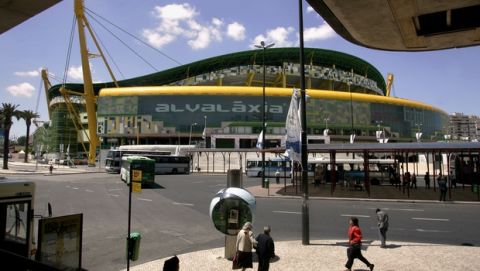 People pass by the bus station in front of the Jose Alvalade stadium in Lisbon, Tuesday, May 17, 2005. CSKA Moscow will play Sporting Lisbon in the Uefa Cup final on Wednesday in the Jose Alvalade stadium. (AP Photo/Bernat Armangue) 