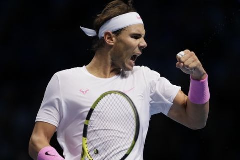 Rafael Nadal of Spain reacts after winning a point against Daniil Medvedev of Russia during their ATP World Tour Finals singles tennis match at the O2 Arena in London, Wednesday, Nov. 13, 2019. (AP Photo/Kirsty Wigglesworth)