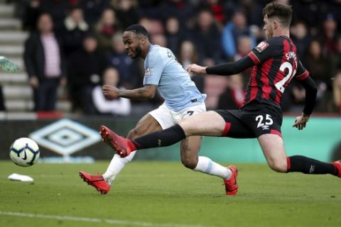 Manchester City's Raheem Sterling, left and Bournemouth's Jack Simpson battle for the ball, during the English Premier League soccer match between Bournemouth and Manchester City,  at the Vitality Stadium, in  Bournemouth, England, Saturday March 2, 2019. (Adam Davy/PA via AP)