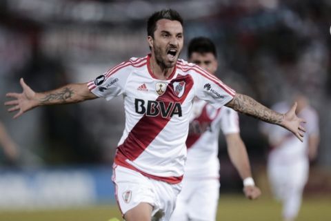 In this July 4, 2017 photo, striker Ignacio Scocco of Argentina's River Plate celebrates after scoring during a Copa Libertadores soccer game against Paraguay's Guarani in Asuncion, Paraguay. (AP Photo/Jorge Saenz)
