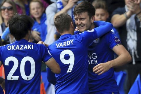 Leicester City's Harry Maguire, right, celebrates scoring his side's second goal during their English Premier League soccer match against Brighton at the King Power Stadium, Leicester, England, Saturday, Aug. 19, 2017. (Nigel French/PA via AP)