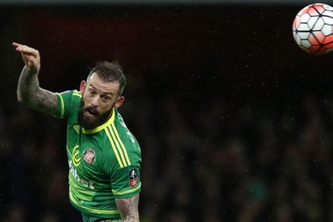 Sunderlands Steven Fletcher leaps in his attempt to head the ball during the English FA Cup third round soccer match between Arsenal and Sunderland at the Emirates stadium in London, Saturday, Jan. 9, 2016 . (AP Photo/Alastair Grant)