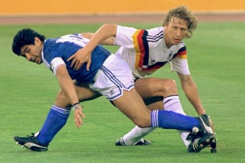 ** FILE ** Argentina's Diego Maradona and West Germany's Guido Buchwald tangle with one another during the World Cup soccer final in Rome on August, 7, 1990, won by the Germans 1-0. Argentina and Germany will meet Friday June 30 in Berlin in a quarterfinal match of the 2006 soccer World Cup. (AP Photo)