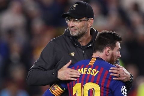 Barcelona's Lionel Messi, who scored two of the team's three goals, hugs Liverpool coach Juergen Klopp after the Champions League semifinal first leg soccer match between FC Barcelona and Liverpool at the Camp Nou stadium in Barcelona, Spain, Wednesday, May 1, 2019. (AP Photo/Manu Fernandez)