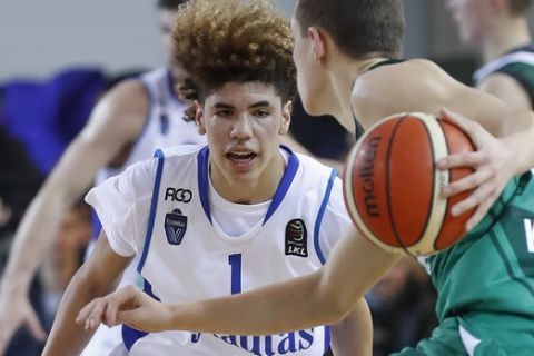 BC Prienu Vytautas's LaMelo Ball in action during the Big Baller Brand Challenge friendly tournament match between BC Prienu Vytautas and BC Zalgiris-2 at the BC Prienai-Birstonas Vytautas arena, in Prienai, Lithuania, Tuesday, Jan. 9, 2018. LiAngelo Ball and LaMelo Ball, sons of former basketball player LaVar Ball, have signed a one-year contract and play their first match for Lithuanian professional basketball club Prienu Vytautas. (AP Photo/Liusjenas Kulbis)