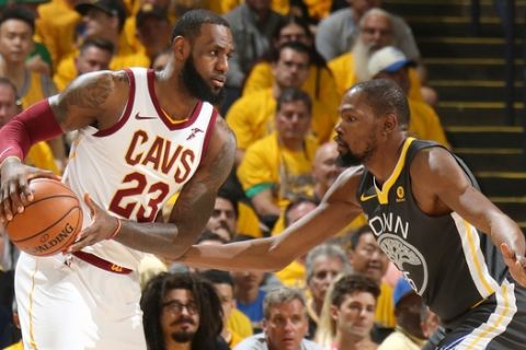 OAKLAND, CA - JUNE 3: LeBron James #23 of the Cleveland Cavaliers handles the ball against Kevin Durant #35 of the Golden State Warriors in Game Two of the 2018 NBA Finals on June 3, 2018 at ORACLE Arena in Oakland, California. NOTE TO USER: User expressly acknowledges and agrees that, by downloading and/or using this photograph, user is consenting to the terms and conditions of Getty Images License Agreement. Mandatory Copyright Notice: Copyright 2018 NBAE (Photo by Nathaniel S. Butler/NBAE via Getty Images)