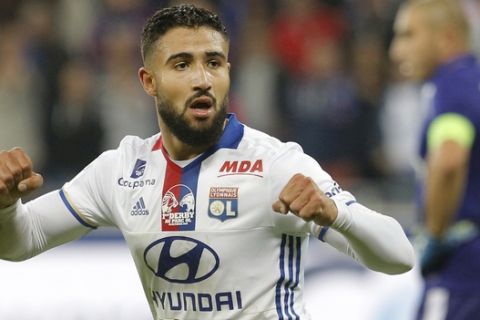 Lyon's Nabil Fekir celebrates scoring, during the French League One soccer match between Lyon and Saint-Etienne, in Decines, near Lyon, central France, Sunday, Oct. 2, 2016. (AP Photo/Laurent Cipriani)