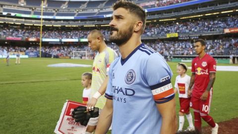 NYCFC forward David Villa, center, walks out before an MLS soccer match against the New York Red Bulls, Wednesday, Aug. 22, 2018, in New York. The match ended in a 1-1 draw. (AP Photo/Steve Luciano)