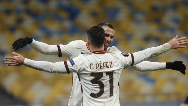 Roma's Borja Mayoral celebrates with Roma's Carles Perez after scoring his side's second goal during the Europa League round of 16 second leg soccer match between Shakhtar Donetsk and Roma at the Olimpiyskiy Stadium in Kyiv, Ukraine, Thursday, March 18, 2021. (AP Photo/Efrem Lukatsky)
