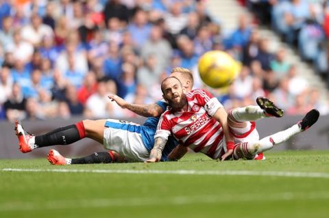 GLASGOW, SCOTLAND - AUGUST 06: Martyn Waghorn of Rangers and  Georgeous Sarris of Hamilton Academical during the Ladbrokes Scottish Premiership match between Rangers and Hamilton Academical at Ibrox Stadium on August 6, 2016 in Glasgow, Scotland. (Photo by Lynne Cameron/Getty Images)