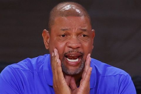 Los Angeles Clippers head coach Doc Rivers yells to his team during the fourth quarter of Game 4 of an NBA basketball first-round playoff series against the Dallas Mavericks, Sunday, Aug. 23, 2020, in Lake Buena Vista, Fla. (Kevin C. Cox/Pool Photo via AP)