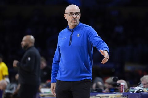 Dallas Mavericks head coach Jason Kidd asks for his clipboard during a time out in the first half of an NBA basketball game against the Los Angeles Lakers, Wednesday, Jan. 17, 2024, in Los Angeles. (AP Photo/Marcio Jose Sanchez)