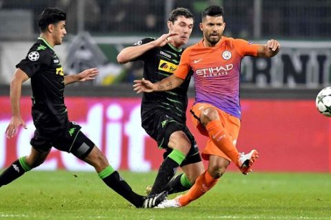 Manchester City's Sergio Aguero, right, kicks the ball during the Champions League Group C soccer match between Borussia Moenchengladbach and Manchester City in Moenchengladbach, Germany, Wednesday, Nov. 23, 2016. (AP Photo/Martin Meissner)