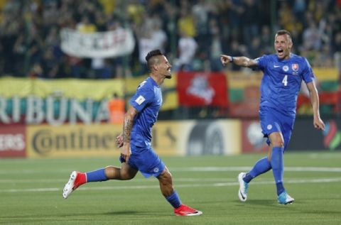 Slovakia's Marek Hamsik, left, and Jan Durica celebrates after scoring goal during the World Cup Group F qualifying soccer match between Lithuania and Slovakia at LFF stadium in Vilnius, Lithuania, Saturday, June 10, 2017. (AP Photo/Mindaugas Kulbis)