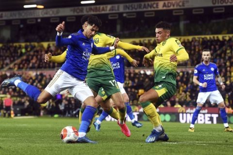 Leicester City's Ayoze Perez, left, and Norwich City's Ben Godfrey battle for the ball during the English Premier League soccer match at Carrow Road, Norwich, Friday Feb. 28, 2020. (Joe Giddens/PA via AP)