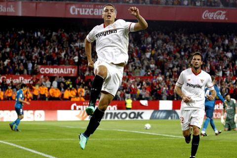 Sevilla's Ben Yedder, celebrates after scoring against Real Madrid during La Liga soccer match between Sevilla and Real Madrid at the Sanchez Pizjuan stadium, in Seville, Spain, on Wednesday, May. 9, 2018. (AP Photo/Miguel Morenatti)