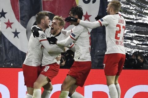 Leipzig's Emil Forsberg, second from left, celebrates with teammates after scoring his side's second goal during the Champions League group G soccer match between RB Leipzig and Benfica in Leipzig, Germany, Wednesday, Nov. 27, 2019. (AP Photo/Jens Meyer)