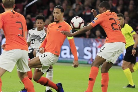 Germany's Serge Gnabry, third from right, scores his side's second goal during the Euro 2020 group C qualifying soccer match between Netherlands and Germany at the Johan Cruyff ArenA in Amsterdam, Sunday, March 24, 2019. (AP Photo/Peter Dejong)