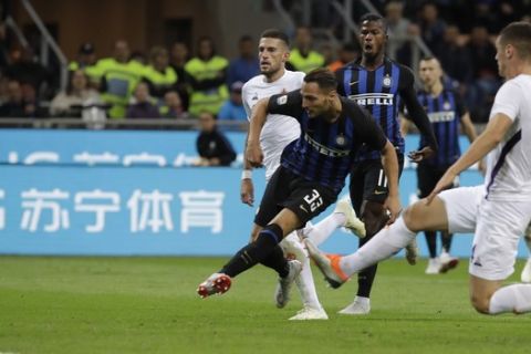 Inter Milan's Danilo D'Ambrosio scores his side's second goal during the Serie A soccer match between Inter Milan and Fiorentina, at the San Siro stadium in Milan, Italy, Tuesday, Sept. 25, 2018. (AP Photo/Luca Bruno)