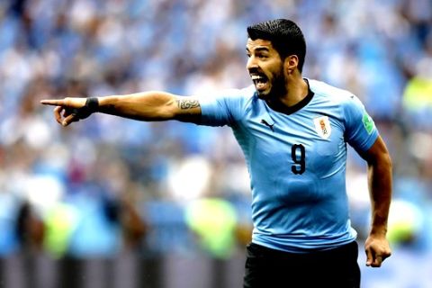 Uruguay's Luis Suarez points during the quarterfinal match between Uruguay and France at the 2018 soccer World Cup in the Nizhny Novgorod Stadium, in Nizhny Novgorod, Russia, Friday, July 6, 2018. (AP Photo/David Vincent)