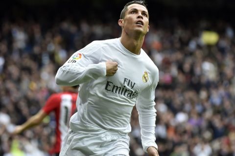 Real Madrid's Portuguese forward Cristiano Ronaldo celebrates after scoring during the Spanish league football match Real Madrid CF vs Athletic Club Bilbao at the Santiago Bernabeu stadium in Madrid on February 13, 2016. / AFP / GERARD JULIEN        (Photo credit should read GERARD JULIEN/AFP/Getty Images)