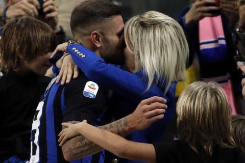 Inter Milan's Mauro Icardi, center, celebrates with his family after scoring during the Serie A soccer match between Inter Milan and AC Milan at the San Siro Stadium, in Milan, Italy, Sunday, Oct. 21, 2018. (AP Photo/Antonio Calanni)