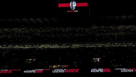 A picture of Kobe Bryant is projected on a giant screen during the Italian Cup, quarterfinal soccer match between AC Milan and Torino at the Milan San Siro Stadium, Tuesday, Jan. 28, 2020. Bryant, an 18-time NBA All-Star with the Los Angeles Lakers and a lifelong soccer fan, died Sunday with his 13-year-old daughter, Gianna, in a helicopter crash near Calabasas, California. He was 41. (Spada/Lapresse via AP)