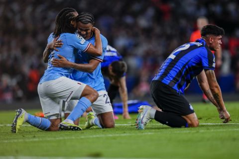 Manchester City players, left, celebrate after winning the Champions League final soccer match against Inter Milan at the Ataturk Olympic Stadium in Istanbul, Turkey, Saturday, June 10, 2023. (AP Photo/Manu Fernandez)