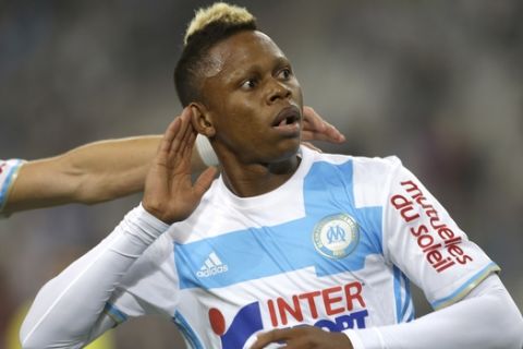 Marseille's midfielder Clinton Mua Njie celebrates after scoring during the League One soccer match between Marseille and Nantes, in Marseille, southern France, Sunday, Sep. 25, 2016. (AP Photo/Claude Paris)