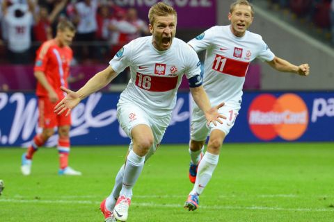 WARSAW, POLAND - JUNE 12:  Jakub Blaszczykowski of Poland celebrates scoring their first goal during the UEFA EURO 2012 group A match between Poland and Russia at The National Stadium on June 12, 2012 in Warsaw, Poland.  (Photo by Shaun Botterill/Getty Images)