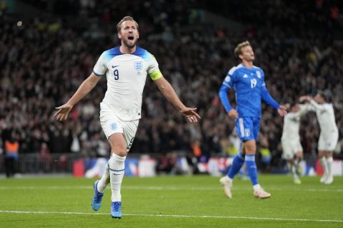 England's Harry Kane celebrates after scoring his side's third goal during the Euro 2024 group C qualifying soccer match between England and Italy at Wembley stadium in London, Tuesday, Oct. 17, 2023. (AP Photo/Kirsty Wigglesworth)