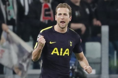 Tottenham's Harry Kane celebrates after scoring his side's opening goal during the Champions League, round of 16, first-leg soccer match between Juventus and Tottenham Hotspurs, at the Allianz Stadium in Turin, Italy, Tuesday, Feb. 13, 2018. (AP Photo/Antonio Calanni)